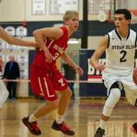 <p>Skylar Sinon (2) of Byram Hills dribbles, as TZ&#x27;s Matt McGivney defends.</p>