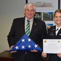 <p>Mahwah Mayor Bill Laforet received an American flag that flew in Afghanistan from Danielle Ullman, a Mahwhah resident who serves in the U.S. Army.</p>