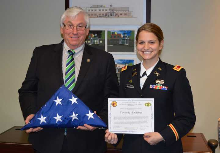 Mahwah Mayor Bill Laforet received an American flag that flew in Afghanistan from Danielle Ullman, a Mahwhah resident who serves in the U.S. Army.