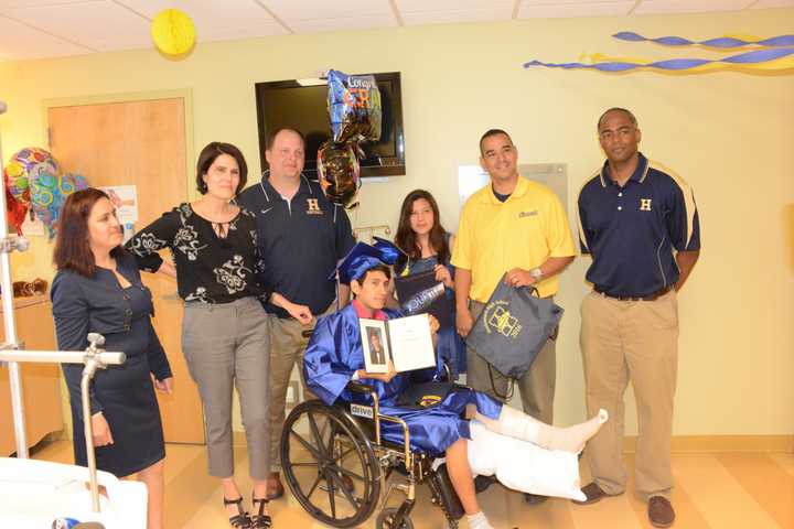 L to R: Mother Marta Peralta, School Counselor Maggie Magner, Principal James Montesano, Jose Guallpa-Peralta, Sister Catherinne Peralta, Asst. Principals Dr. Anibal Galiana and Celso King.