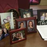 <p>Pictures of family sit on Gills desk at North Rockland High School.</p>