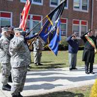 <p>Saluting the flag at Roy W. Brown Middle School before the parade began.</p>