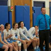 <p>Mounties coach Rich Burger and the Suffern bench watch the action.</p>