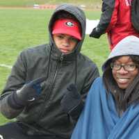 <p>Staying warm at Wednesday chilly track meet.</p>