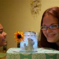 <p>Brittany Gregorio and son Jayden with the Glow Jars they teamed up to create.</p>