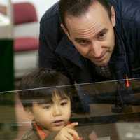 <p>A man and a young boy check out the trains at the Wilton Historical society.</p>