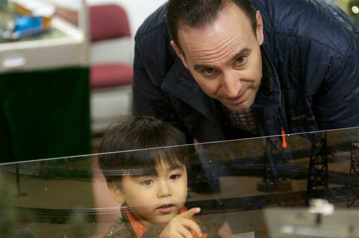 A man and a young boy check out the trains at the Wilton Historical society.