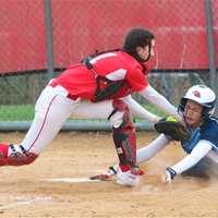 <p>Ursuline&#x27;s Korina Guerra is called out at the plate, as North Rockland catcher Bella Chiorazzi applies the tag.</p>