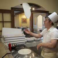 <p>Amore&#x27;s pizza chef spins up a pie.</p>