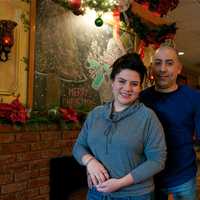 <p>Owner Mario Espana and his daughter, Ally, in front of the restaurant&#x27;s warmly decorated fireplace.</p>