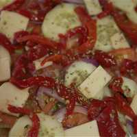 <p>The salad pizza is packed with veggies.</p>