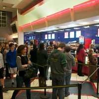 <p>A line of people wait to buy tickets for &#x27;Star Wars&#x27; on Thursday evening in Stamford. </p>