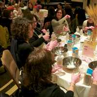 <p>Women make Challah at the Mega Challah Bake.</p>