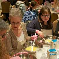 <p>Women mix ingredients at Thursday&#x27;s Mega Challah Bake.</p>