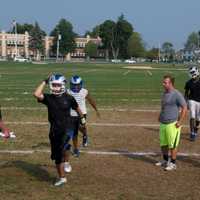 <p>The Rams practice under the watchful eye of new Head Coach Paul Santavicca.</p>