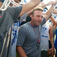 <p>Port Chester Head Coach Paul Santavicca gets his players fired up at a recent practice.</p>