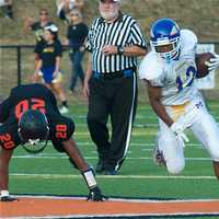 <p>Mahopac&#x27;s Fard Helton picks up yardage.</p>