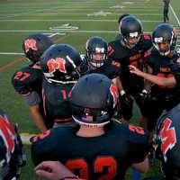 <p>The Tigers in a huddle during timeout.</p>