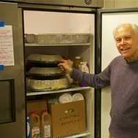 <p>Bob Mitchell and the Saugatuck Congregational Church have all the food ready to go for Christmas day.</p>