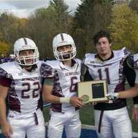 <p>Scarsdale captains pose with the Class AA runnerup plaque.</p>