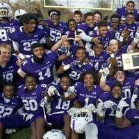 <p>New Rochelle poses with the Section 1 championship plaque.</p>