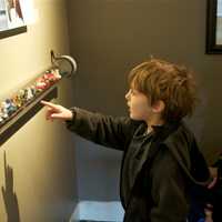 <p>A boy checks out Star Wars figures at the display.</p>