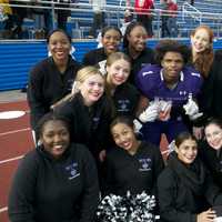 <p>New Rochelle&#x27;s Najee Bass (1) poses with New Rochelle cheerleaders after the Raiders&#x27; win over Scarsdale.</p>