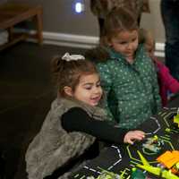 <p>Kids check out the Lego displays.</p>