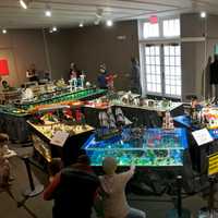 <p>Visitors take in the Lego displays.</p>