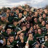 <p>Pleasantville celebrates with the Section 1 championship trophy Saturday at Mahopac High School.</p>