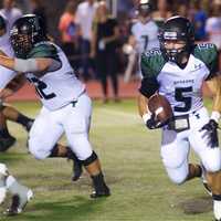 <p>Yorktown rushing leader Nick Santavicca was held to under 50 yards by the Rye defense.</p>