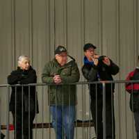 <p>Fans watch the action Sunday night at Brewster Ice Arena.</p>