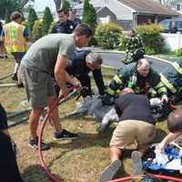19-Year-Old Woman, Three Dogs Rescued From Islip Terrace House Fire