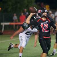 <p>Tj Lavelle rolls out to look for a receiver in Friday&#x27;s win over Yorktown.</p>