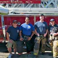 <p>Mt. Kisco firemen pose for a photo at Sale Days.</p>