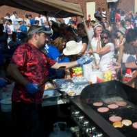 <p>Fans and game officials flock to the food area at Saturday&#x27;s game.</p>