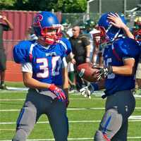 <p>The Carmel football team celebrates after a late TD Saturday.</p>