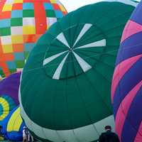 <p>Balloons are inflated prior to a mass launch at the 2013 festival.</p>