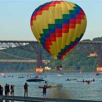 <p>A balloon stays above water at the 2013 festival.</p>