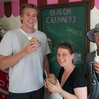 <p>Team mom Paige Flory, with Renegades pitcher J.D. Busfield (L) and second baseman Miles Mastrobuoni.</p>