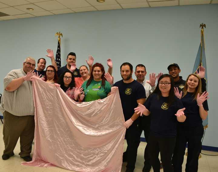 Lyndhurst Police Emergency Squad wearing pink gloves to support breast cancer awareness.