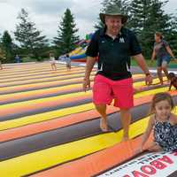 <p>Guests enjoy jumping in a giant inflated mattress at Barton Orchards.</p>