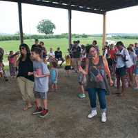 <p>Guests dance to the sounds of FDR Band Friday at Barton Orchards.</p>