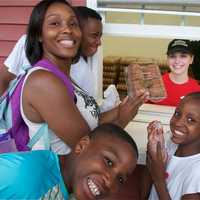 <p>This family just got a little happier after finding fresh apple cider donuts at Barton Orchards.</p>