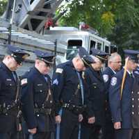 <p>A somber moment honoring the fallen.</p>