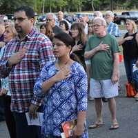 <p>Pledging allegiance to the flag.</p>