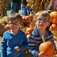 <p>Two boys having fun in the pumpkin patch at Silverman&#x27;s Farm.</p>