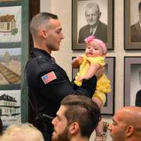 <p>As he awaits his swearing in ceremony, Corey Rooney shares a moment with his niece.</p>