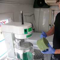 <p>Michael Fertucci turns frozen green tea into a shaved ice treat.</p>