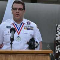 <p>Eagle Scout David Tarantino singing the national anthem.</p>